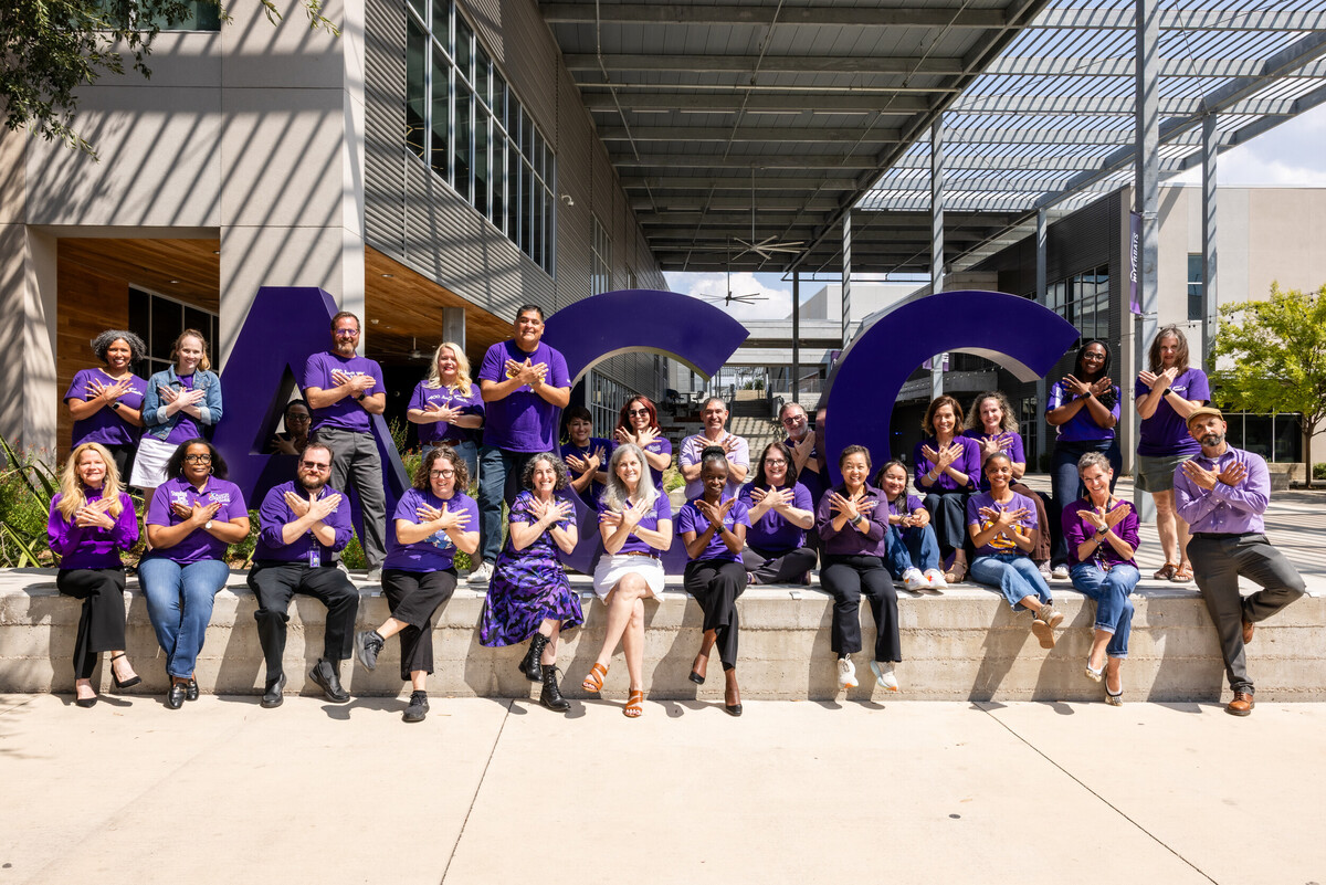 The ACC CLI Group 2 pose in front of the ACC sign at ACC Highland campus. 