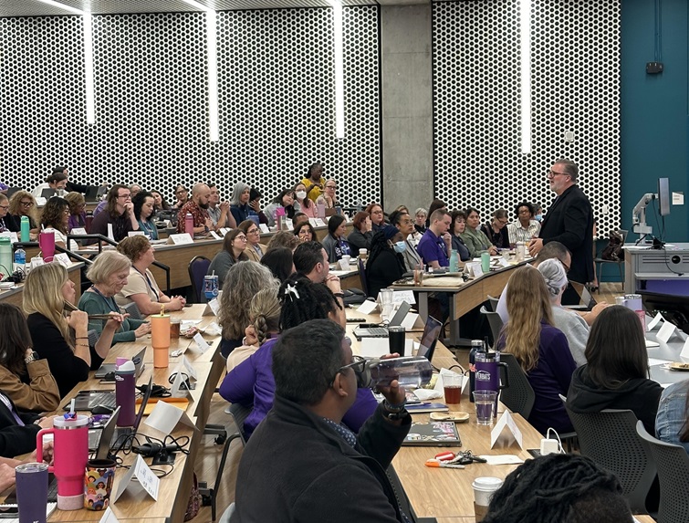Chancellor Russell Lowery-Hart speaks to a large group.